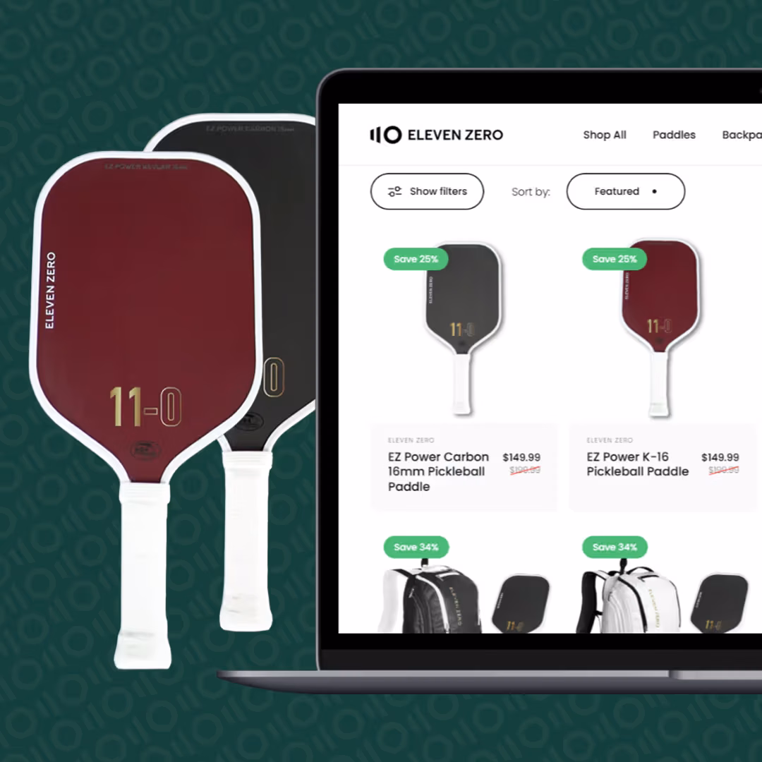 Two Eleven Zero pickleball paddles next to a laptop displaying the online store's paddle listing page.